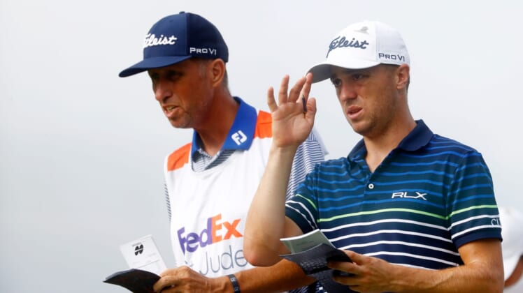Justin Thomas talks with his caddy, Jim "Bones" Mackay, on the tee of the Par 3, No. 14 during the second round of the 2020 WGC FedEx-St. Jude Invitational on Friday, July 31, 2020 at TPC Southwind in Memphis, Tenn.Edit Wgc W 25820