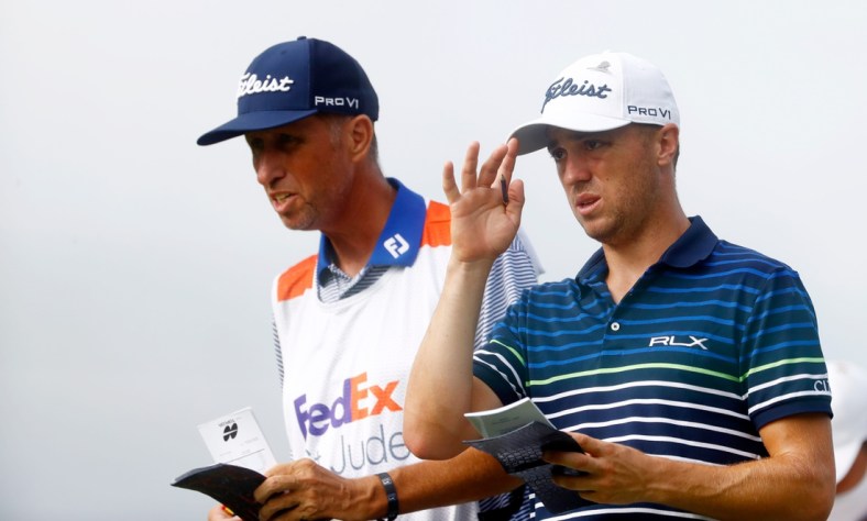 Justin Thomas talks with his caddy, Jim "Bones" Mackay, on the tee of the Par 3, No. 14 during the second round of the 2020 WGC FedEx-St. Jude Invitational on Friday, July 31, 2020 at TPC Southwind in Memphis, Tenn.

Edit Wgc W 25820