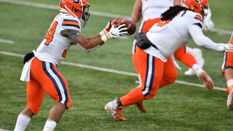 Dec 5, 2020; South Bend, Indiana, USA; Syracuse Orange running back Sean Tucker (34) takes a direct snap in the second quarter against the Notre Dame Fighting Irish at Notre Dame Stadium. Mandatory Credit: Matt Cashore-USA TODAY Sports