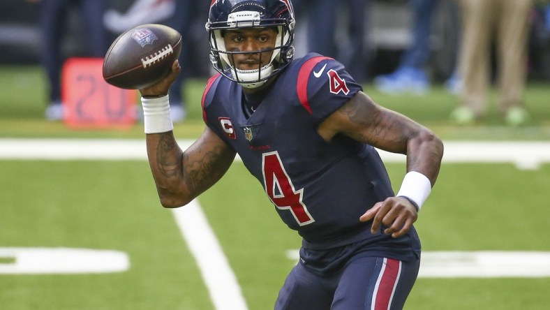 Dec 27, 2020; Houston, Texas, USA; Houston Texans quarterback Deshaun Watson (4) rolls out of the pocket against the Cincinnati Bengals during the third quarter at NRG Stadium. Mandatory Credit: Troy Taormina-USA TODAY Sports