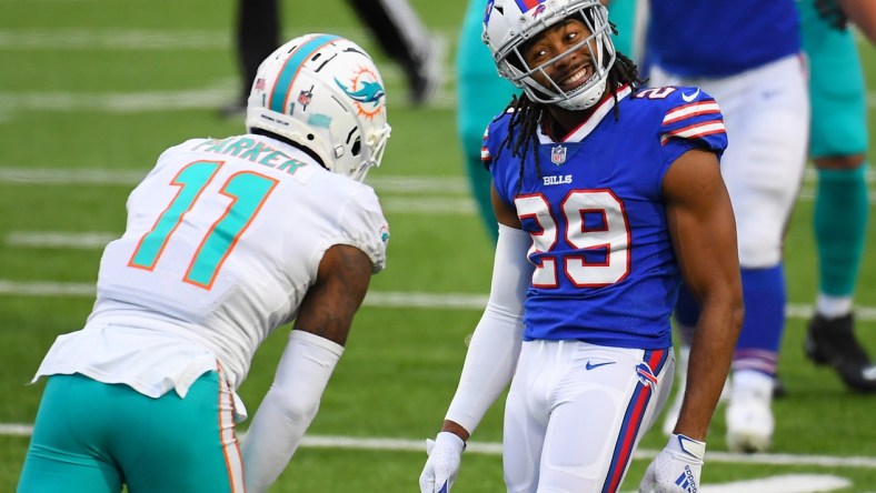 Jan 3, 2021; Orchard Park, New York, USA; Buffalo Bills cornerback Josh Norman (29) reacts in the direction of Miami Dolphins wide receiver DeVante Parker (11) following a defensive play during the third quarter at Bills Stadium. Mandatory Credit: Rich Barnes-USA TODAY Sports