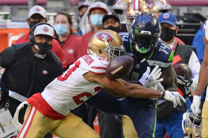 Jan 3, 2021; Glendale, Arizona, USA; San Francisco 49ers cornerback Ahkello Witherspoon (23) breaks up a pass intended for Seattle Seahawks wide receiver DK Metcalf (14) during the second half at State Farm Stadium. Mandatory Credit: Joe Camporeale-USA TODAY Sports