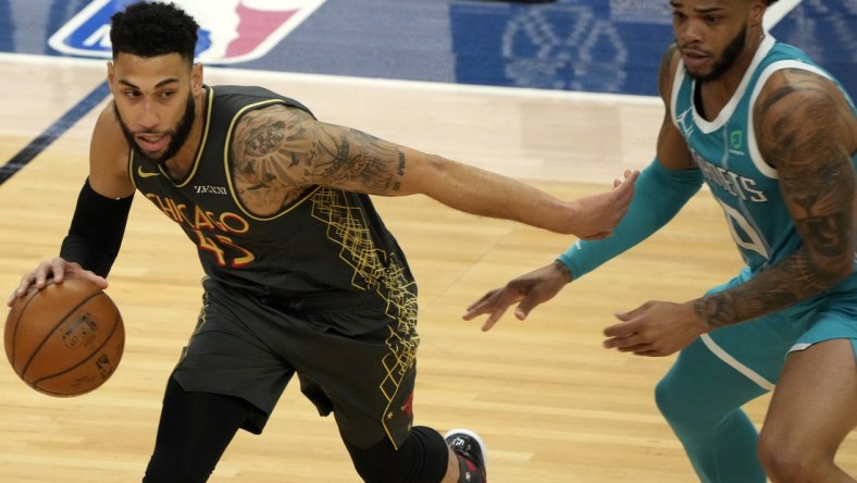 Apr 22, 2021; Chicago, Illinois, USA; Chicago Bulls guard Denzel Valentine (45) dribbles the ball against Charlotte Hornets forward Miles Bridges (0) during the second quarter at the United Center. Mandatory Credit: Mike Dinovo-USA TODAY Sports