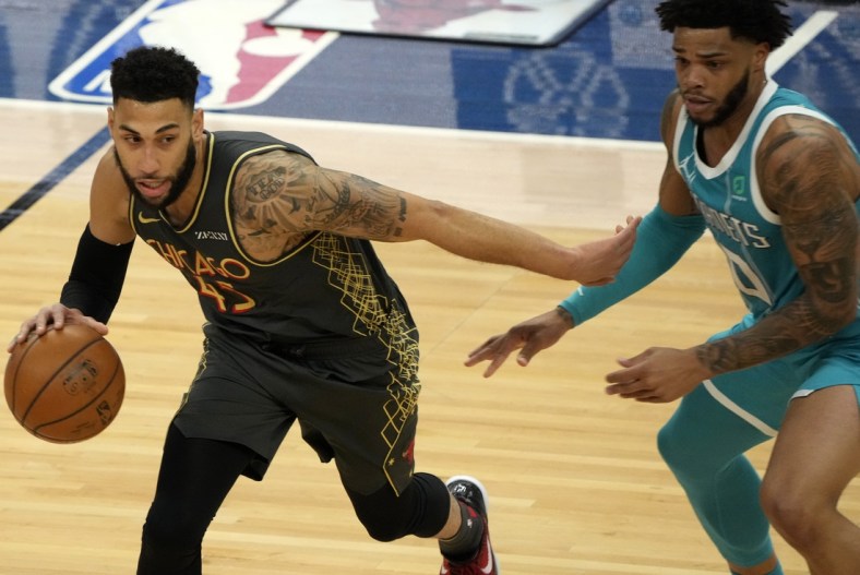 Apr 22, 2021; Chicago, Illinois, USA; Chicago Bulls guard Denzel Valentine (45) dribbles the ball against Charlotte Hornets forward Miles Bridges (0) during the second quarter at the United Center. Mandatory Credit: Mike Dinovo-USA TODAY Sports