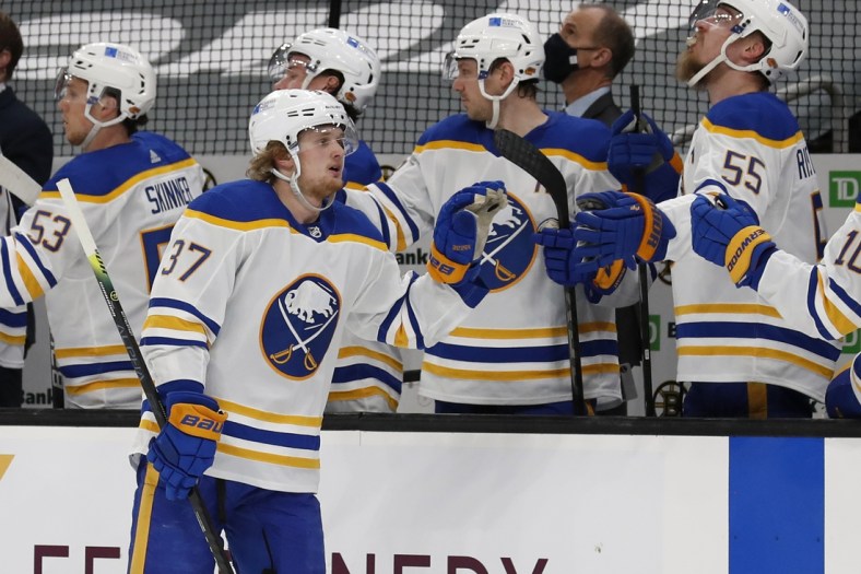 Apr 29, 2021; Boston, Massachusetts, USA; Buffalo Sabres center Casey Mittelstadt (37) celebrates with the bench after scoring against the Boston Bruins during the first period at TD Garden. Mandatory Credit: Winslow Townson-USA TODAY Sports