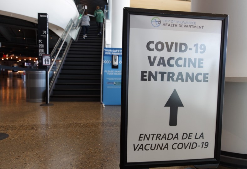 May 2, 2021; Milwaukee, Wisconsin, USA; A sign directing fans where to receive a COVID-19 vaccination prior to the game between the Milwaukee Bucks and the Brooklyn Netsat Fiserv Forum. Mandatory Credit: Jeff Hanisch-USA TODAY Sports