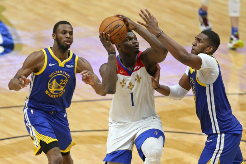 May 4, 2021; New Orleans, Louisiana, USA; New Orleans Pelicans forward Zion Williamson (1) drives on  Golden State Warriors forward Kevon Looney (5) in the third quarter at the Smoothie King Center. Mandatory Credit: Chuck Cook-USA TODAY Sports