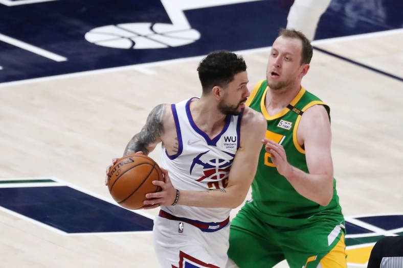 May 7, 2021; Salt Lake City, Utah, USA; Denver Nuggets guard Austin Rivers (25) looks to pass the ball while defended by Utah Jazz guard Joe Ingles (2) in the first quarter at Vivint Arena. Mandatory Credit: Rob Gray-USA TODAY Sports