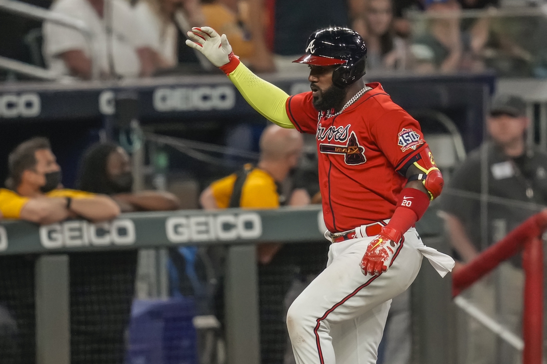 May 21, 2021; Cumberland, Georgia, USA; Atlanta Braves left fielder Marcell Ozuna (20) reacts after hitting a home run against the Pittsburgh Pirates during the sixth inning at Truist Park. Mandatory Credit: Dale Zanine-USA TODAY Sports