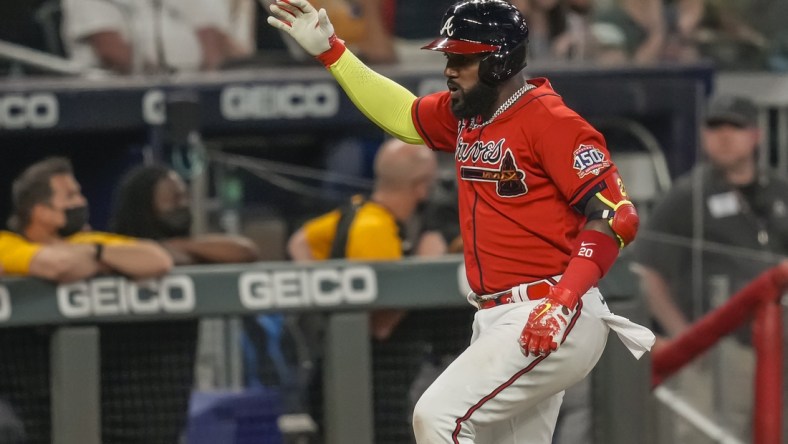 May 21, 2021; Cumberland, Georgia, USA; Atlanta Braves left fielder Marcell Ozuna (20) reacts after hitting a home run against the Pittsburgh Pirates during the sixth inning at Truist Park. Mandatory Credit: Dale Zanine-USA TODAY Sports