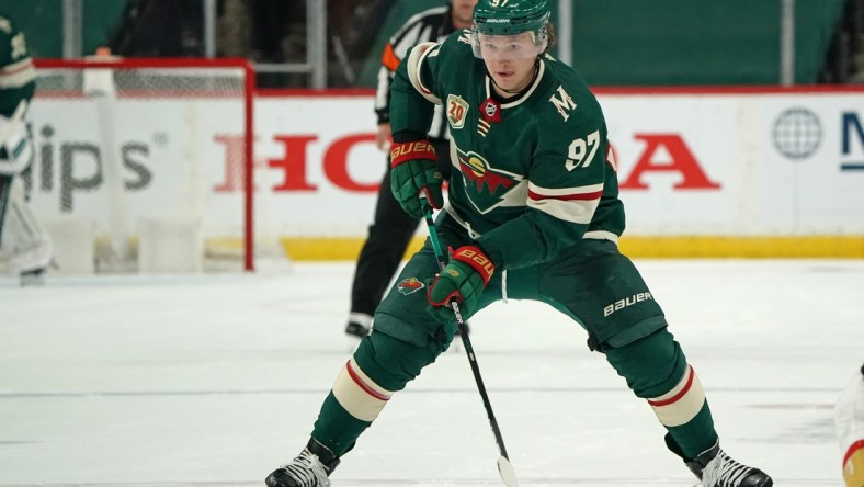 May 22, 2021; Saint Paul, Minnesota, USA; Minnesota Wild left wing Kirill Kaprizov (97) skates with the puck against the Vegas Golden Knights in game four of the first round of the 2021 Stanley Cup Playoffs at Xcel Energy Center. Mandatory Credit: Nick Wosika-USA TODAY Sports