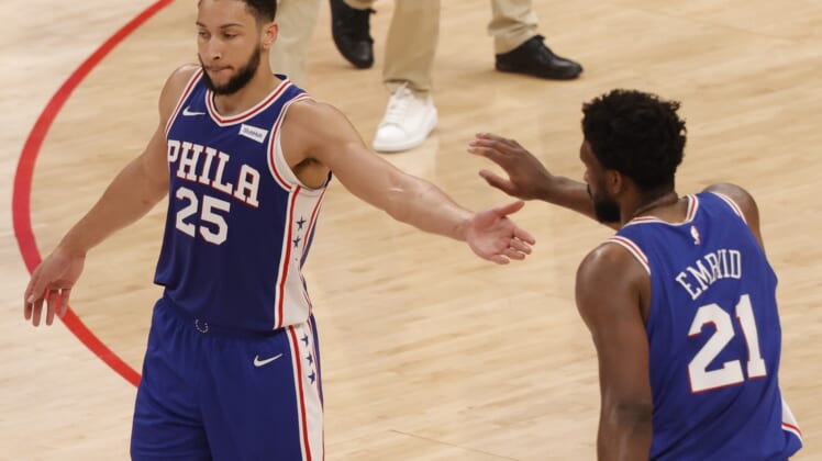 May 29, 2021; Washington, District of Columbia, USA; Philadelphia 76ers center Joel Embiid (21) celebrates with 76ers guard Ben Simmons (25) against the Washington Wizards in the third quarter during game three in the first round of the 2021 NBA Playoffs at Capital One Arena. Mandatory Credit: Geoff Burke-USA TODAY Sports