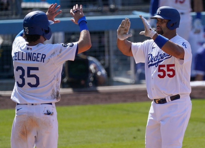 May 30, 2021; Los Angeles, California, USA; Los Angeles Dodgers first baseman Albert Pujols (55) celebrates with center fielder Cody Bellinger (35) after hitting a two-run home run during the ninth inning against the San Francisco Giants at Dodger Stadium. Mandatory Credit: Robert Hanashiro-USA TODAY Sports