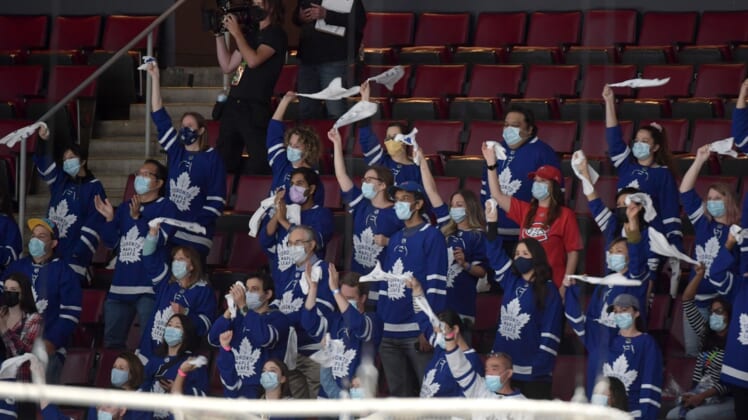 May 31, 2021; Toronto, Ontario, CAN; Health care workers cheer for their team after being given free seats to watch the Montreal Canadiens and Toronto Maple Leafs play game seven of the first round of the 2021 Stanley Cup Playoffs at Scotiabank Arena. Mandatory Credit: Dan Hamilton-USA TODAY Sports