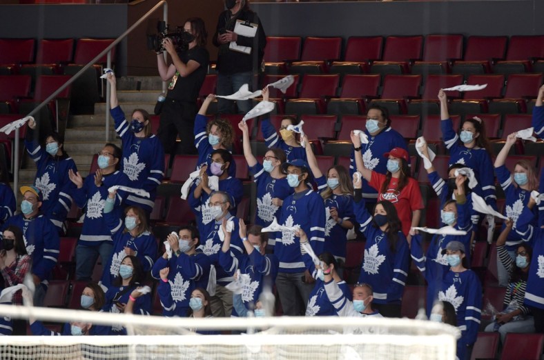 May 31, 2021; Toronto, Ontario, CAN; Health care workers cheer for their team after being given free seats to watch the Montreal Canadiens and Toronto Maple Leafs play game seven of the first round of the 2021 Stanley Cup Playoffs at Scotiabank Arena. Mandatory Credit: Dan Hamilton-USA TODAY Sports