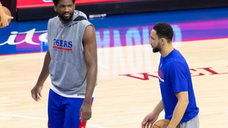 Jun 2, 2021; Philadelphia, Pennsylvania, USA; Philadelphia 76ers center Joel Embiid (L) talks with guard Ben Simmons (R) before game five in the first round of the 2021 NBA Playoffs against the Washington Wizards at Wells Fargo Center. Mandatory Credit: Bill Streicher-USA TODAY Sports