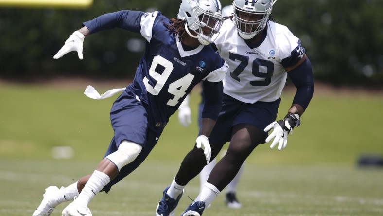 Jun 8, 2021; Frisco, TX, USA; Dallas Cowboys defensive end Randy Gregory (94) goes through drills against Dallas Cowboys tackle Ty Nsekhe (79) during voluntary Organized Team Activities at the Ford Center at the Star Training Facility in Frisco, Texas. Mandatory Credit: Tim Heitman-USA TODAY Sports