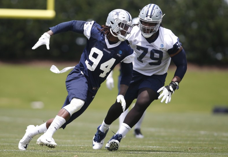 Jun 8, 2021; Frisco, TX, USA; Dallas Cowboys defensive end Randy Gregory (94) goes through drills against Dallas Cowboys tackle Ty Nsekhe (79) during voluntary Organized Team Activities at the Ford Center at the Star Training Facility in Frisco, Texas. Mandatory Credit: Tim Heitman-USA TODAY Sports