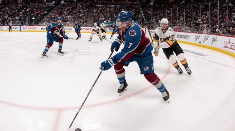Jun 8, 2021; Denver, Colorado, USA; Colorado Avalanche defenseman Devon Toews (7) controls the puck ahead of Vegas Golden Knights defenseman Shea Theodore (27) in the second period in game five of the second round of the 2021 Stanley Cup Playoffs at Ball Arena. Mandatory Credit: Isaiah J. Downing-USA TODAY Sports