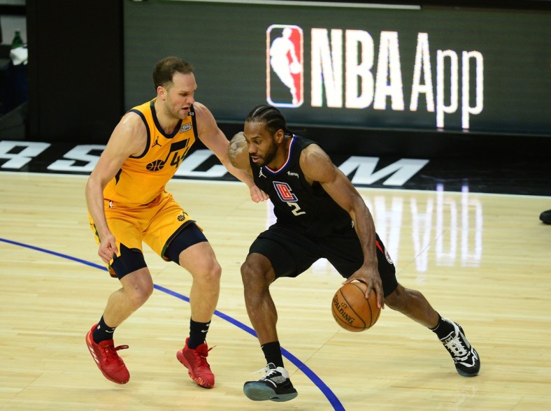 Jun 14, 2021; Los Angeles, California, USA; Los Angeles Clippers forward Kawhi Leonard (2) moves the ball against Utah Jazz forward Bojan Bogdanovic (44) during the second half in game four in the second round of the 2021 NBA Playoffs. at Staples Center. Mandatory Credit: Gary A. Vasquez-USA TODAY Sports
