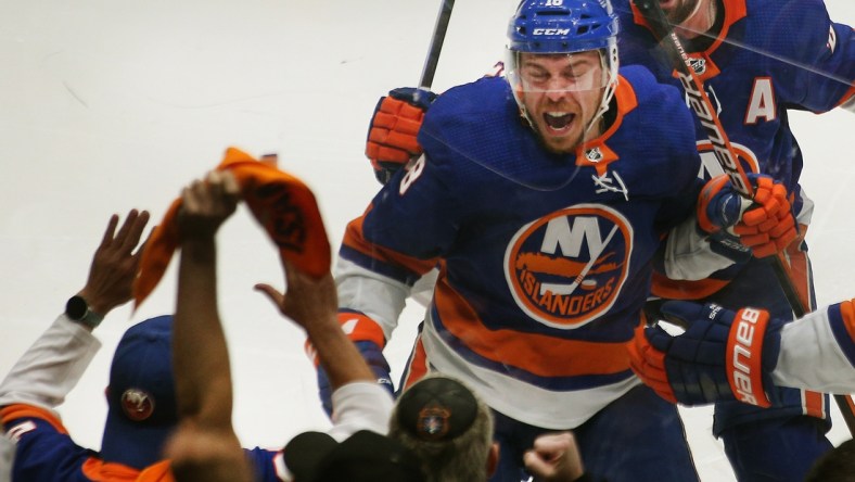 Jun 23, 2021; Uniondale, New York, USA; New York Islanders left wing Anthony Beauvillier (18) reacts after scoring the game winning goal against the Tampa Bay Lightning during overtime in game six of the 2021 Stanley Cup Semifinals at Nassau Veterans Memorial Coliseum. Mandatory Credit: Andy Marlin-USA TODAY Sports