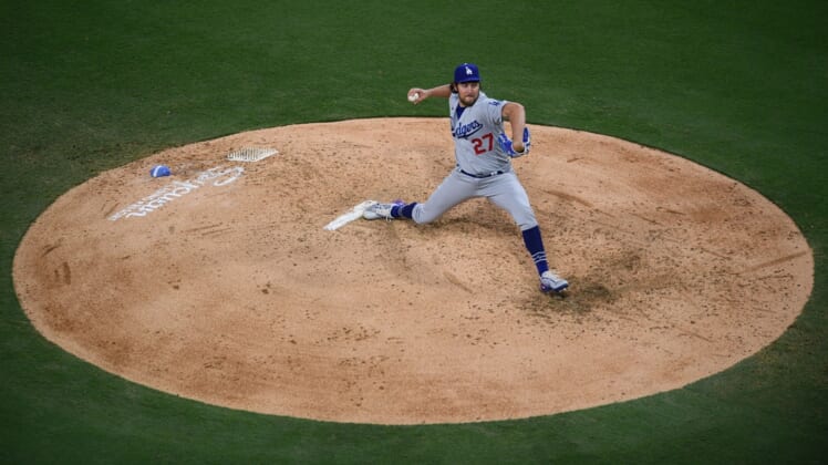 Jun 23, 2021; San Diego, California, USA; Los Angeles Dodgers starting pitcher Trevor Bauer (27) throws a pitch against the San Diego Padres during the fourth inning at Petco Park. Mandatory Credit: Orlando Ramirez-USA TODAY Sports