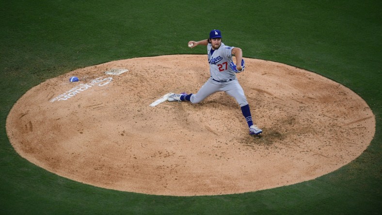 Jun 23, 2021; San Diego, California, USA; Los Angeles Dodgers starting pitcher Trevor Bauer (27) throws a pitch against the San Diego Padres during the fourth inning at Petco Park. Mandatory Credit: Orlando Ramirez-USA TODAY Sports