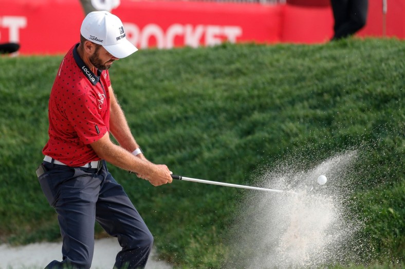 Troy Merritt hits out of 15th bunker during the second round of sudden death playoff of Rocket Mortgage Classic at the Detroit Golf Club in Detroit, Sunday, July 4, 2021.