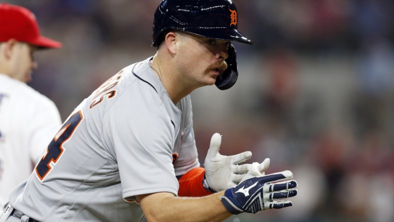 Jul 6, 2021; Arlington, Texas, USA; Detroit Tigers catcher Jake Rogers (34) reacts after reaching third base in the seventh inning against the Texas Rangers at Globe Life Field. Mandatory Credit: Tim Heitman-USA TODAY Sports