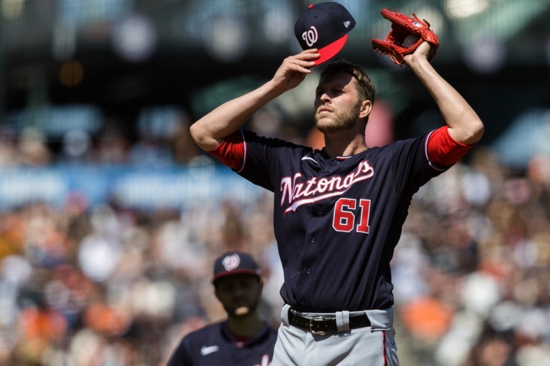 Jul 10, 2021; San Francisco, California, USA;  Washington Nationals relief pitcher Kyle McGowin (61) reacts shortly before being relieved in the sixth inning of the game against the San Francisco Giants at Oracle Park. Mandatory Credit: John Hefti-USA TODAY Sports