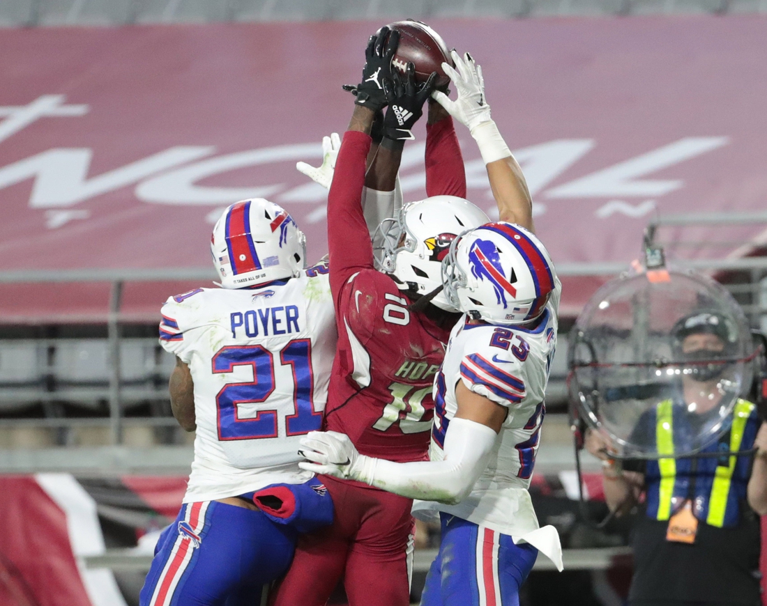 Arizona Cardinals wide receiver DeAndre Hopkins (10) catches the game-winning touchdown between Buffalo Bills safety Jordan Poyer (21), and safety Micah Hyde (23) during the fourth quarter at State Farm Stadium in Glendale, Ariz. Nov. 15, 2020. The Cardinals won 32-30.

Buffalo Bills Vs Arizona Cardinals
