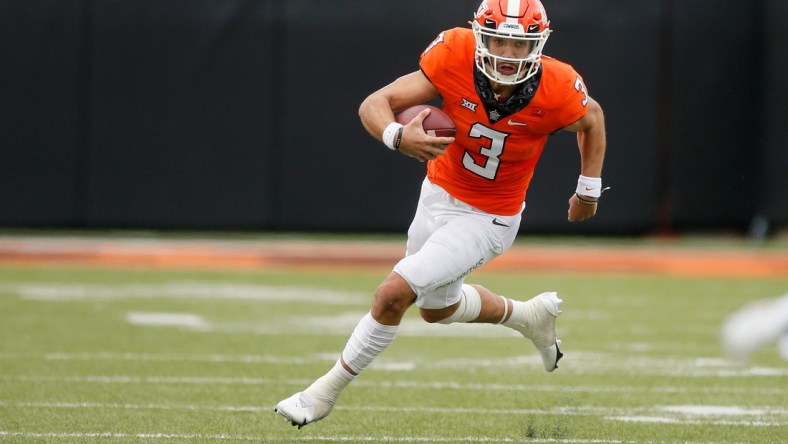 Oklahoma State Cowboys quarterback Spencer Sanders (3) scrambles during a game against Texas Tech last season.