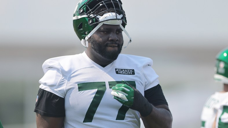 Jul 28, 2021; Florham Park, NJ, United States; New York Jets offensive tackle Mekhi Becton (77) looks on during training camp at Atlantic Health Jets Training Center. Mandatory Credit: Vincent Carchietta-USA TODAY Sports