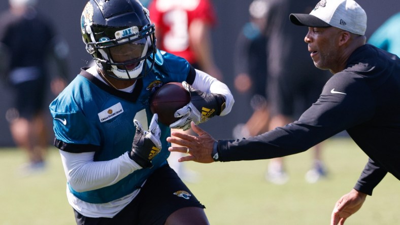 Jul 29, 2021; Jacksonville, FL, USA;  Jacksonville Jaguars running back Travis Etienne (1) participates in training camp at Dream Finders Homes practice field Mandatory Credit: Nathan Ray Seebeck-USA TODAY Sports