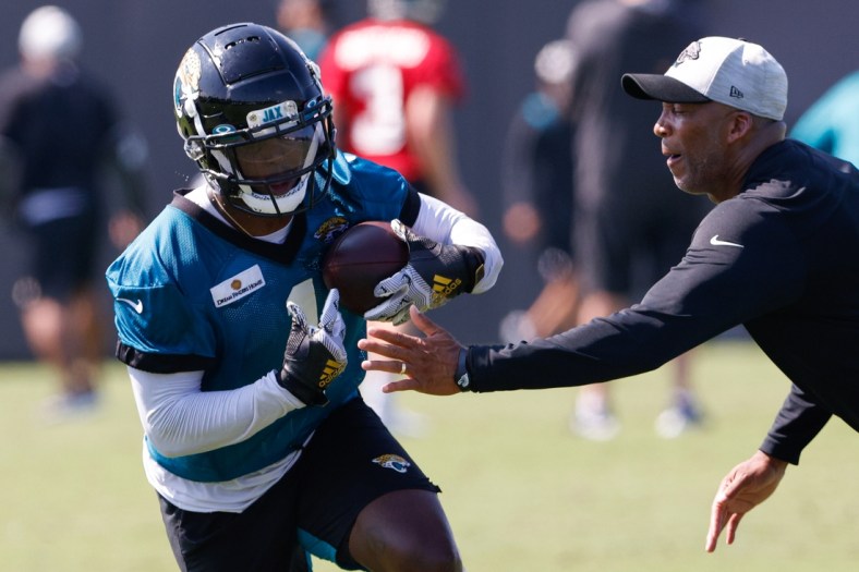 Jul 29, 2021; Jacksonville, FL, USA;  Jacksonville Jaguars running back Travis Etienne (1) participates in training camp at Dream Finders Homes practice field Mandatory Credit: Nathan Ray Seebeck-USA TODAY Sports
