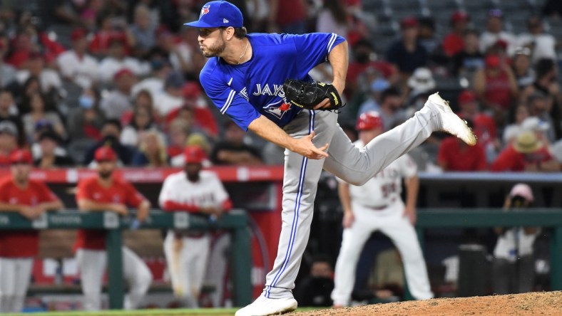 Aug 12, 2021; Anaheim, California, USA; Toronto Blue Jays relief pitcher Connor Overton (44) works the mound in the eighth inning against the Los Angeles Angels at Angel Stadium. Mandatory Credit: Richard Mackson-USA TODAY Sports