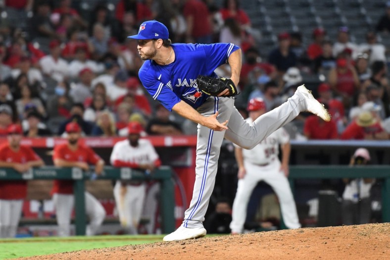 Aug 12, 2021; Anaheim, California, USA; Toronto Blue Jays relief pitcher Connor Overton (44) works the mound in the eighth inning against the Los Angeles Angels at Angel Stadium. Mandatory Credit: Richard Mackson-USA TODAY Sports