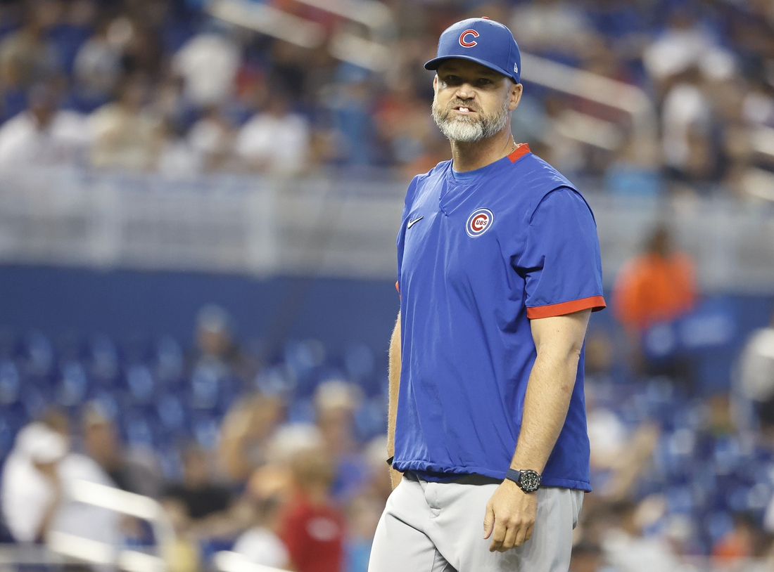 Aug 15, 2021; Miami, Florida, USA; Chicago Cubs manager David Ross (3) walks back to the dugout after making a pitching change during the sixth inning against the Miami Marlins at loanDepot Park. Mandatory Credit: Rhona Wise-USA TODAY Sports