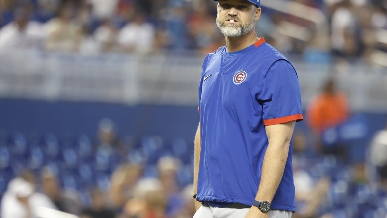 Aug 15, 2021; Miami, Florida, USA; Chicago Cubs manager David Ross (3) walks back to the dugout after making a pitching change during the sixth inning against the Miami Marlins at loanDepot Park. Mandatory Credit: Rhona Wise-USA TODAY Sports