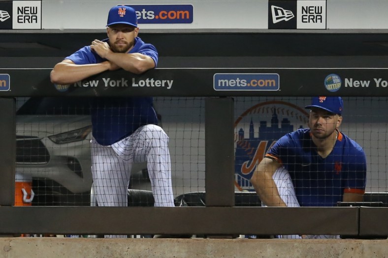 Aug 15, 2021; New York City, New York, USA; New York Mets injured starting pitcher Jacob deGrom (48) watches from the dugout during the sixth inning against the Los Angeles Dodgers at Citi Field. Mandatory Credit: Brad Penner-USA TODAY Sports