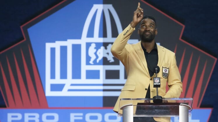 Aug 8, 2021; Canton, Ohio, USA;   Detroit Lions former receiver and inductee Calvin Johnson gestures as he delivers his acceptance speech  during the Class of 2021 NFL Hall of Fame induction ceremony at Tom Benson Hall of Fame Stadium. Mandatory Credit: Charles LeClaire-USA TODAY Sports