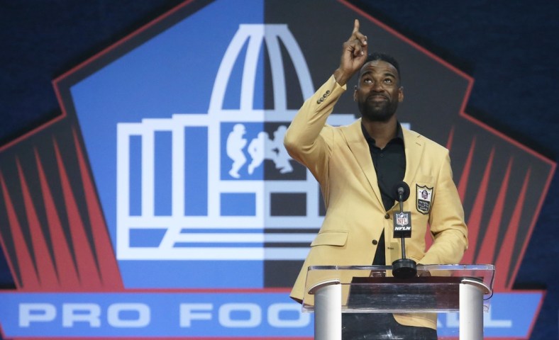 Aug 8, 2021; Canton, Ohio, USA;   Detroit Lions former receiver and inductee Calvin Johnson gestures as he delivers his acceptance speech  during the Class of 2021 NFL Hall of Fame induction ceremony at Tom Benson Hall of Fame Stadium. Mandatory Credit: Charles LeClaire-USA TODAY Sports