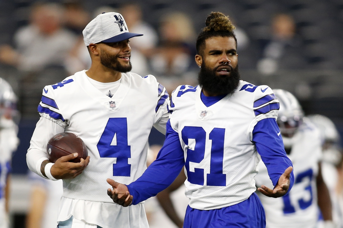 Aug 21, 2021; Arlington, Texas, USA; Dallas Cowboys quarterback Dak Prescott (4) and running back Ezekiel Elliott (21) on the field before the game against the Houston Texans at AT&T Stadium. Mandatory Credit: Tim Heitman-USA TODAY Sports