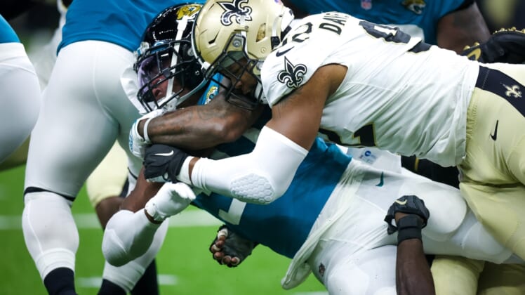 Aug 23, 2021; New Orleans, Louisiana, USA;  New Orleans Saints defensive end Marcus Davenport (92) tackles Jacksonville Jaguars running back Nathan Cottrell (31) during the first half at Caesars Superdome. Mandatory Credit: Stephen Lew-USA TODAY Sports