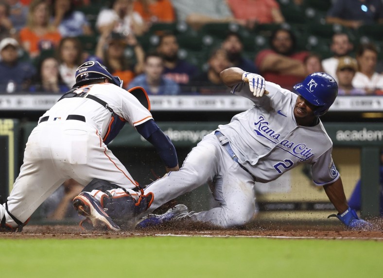 Aug 24, 2021; Houston, Texas, USA; Kansas City Royals center fielder Michael A. Taylor (2) is tagged out by Houston Astros catcher Jason Castro (18) while attempting to steal home during the third inning at Minute Maid Park. Mandatory Credit: Troy Taormina-USA TODAY Sports