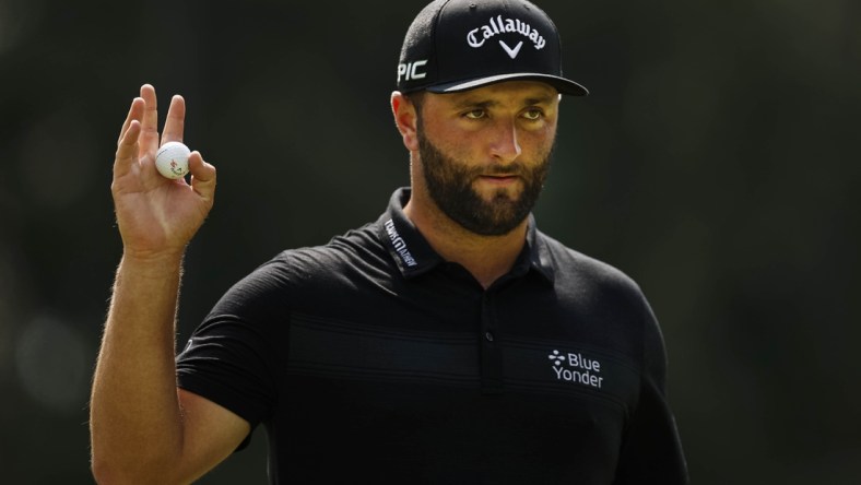 Aug 27, 2021; Owings Mills, Maryland, USA; Jon Rahm waves to fans after sinking his putt on the first hole during the second round of the BMW Championship golf tournament. Mandatory Credit: Scott Taetsch-USA TODAY Sports