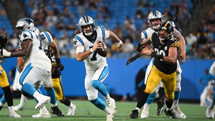 Aug 27, 2021; Charlotte, North Carolina, USA;  Carolina Panthers quarterback Will Grier (7) runs for a touchdown as Pittsburgh Steelers defensive end Isaiahh Loudermilk (92) defends in the fourth quarter at Bank of America Stadium. Mandatory Credit: Bob Donnan-USA TODAY Sports