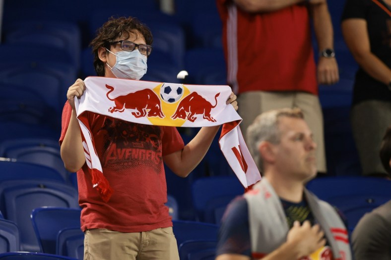Aug 18, 2021; Harrison, New Jersey, USA; A fan holds a scarf before the game between the New York Red Bulls and the Columbus Crew at Red Bull Arena. Mandatory Credit: Vincent Carchietta-USA TODAY Sports