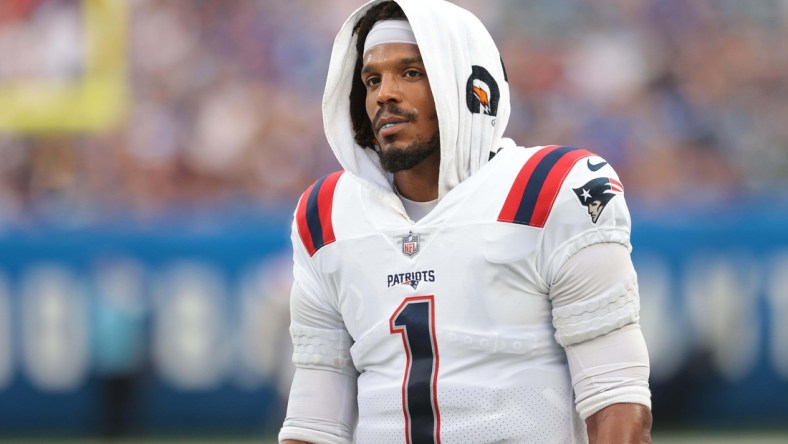 Aug 29, 2021; East Rutherford, New Jersey, USA; New England Patriots quarterback Cam Newton (1) looks on during the first half against the New York Giants at MetLife Stadium. Mandatory Credit: Vincent Carchietta-USA TODAY Sports