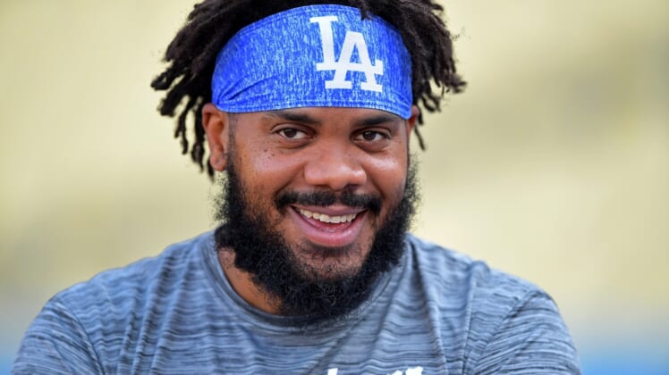 Aug 30, 2021; Los Angeles, California, USA;  Los Angeles Dodgers relief pitcher Kenley Jansen (74) watches players take batting practice before the game against the Atlanta Braves at Dodger Stadium. Mandatory Credit: Jayne Kamin-Oncea-USA TODAY Sports
